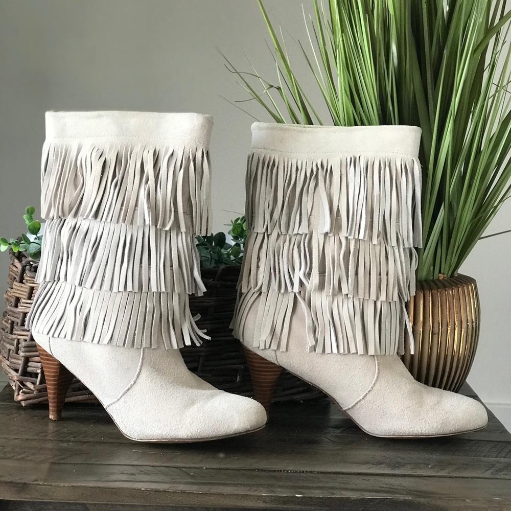 Super cute heeled fringe bootie.